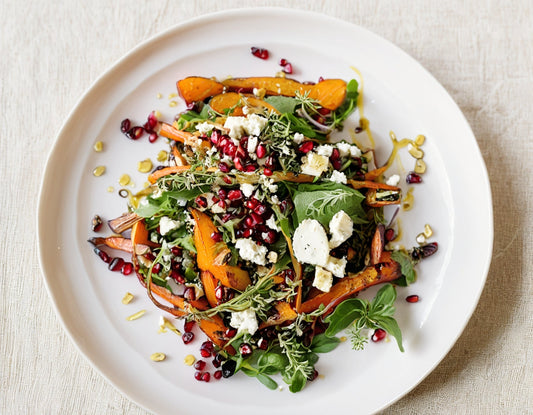 Pomegranate and Grain Salad with Roasted Heirloom Carrots, Oregano Olive Oil, and Feta