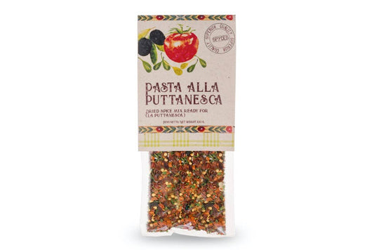 Mix Spices With Dried Black Olives For The Preparation Of Puttanesca Pasta Sauce